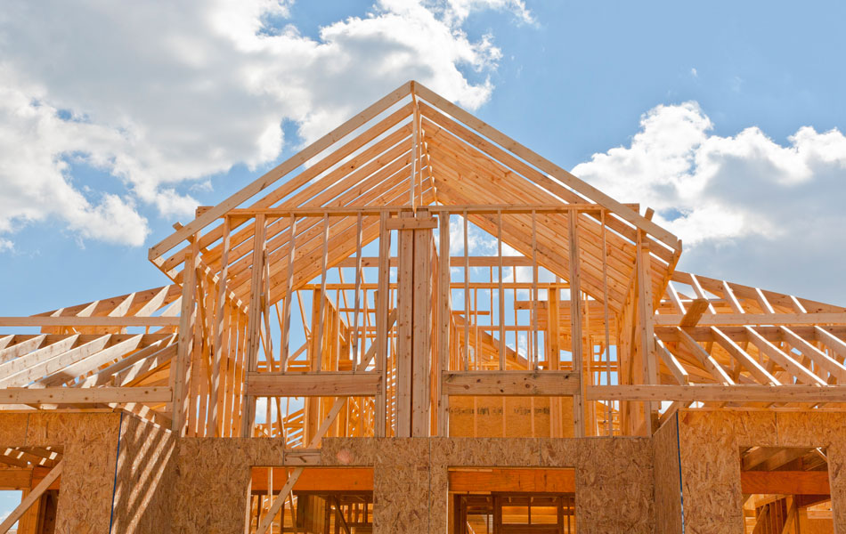 Wood framing of a house during new construction ready for a phase 2 pre-drywall inspection