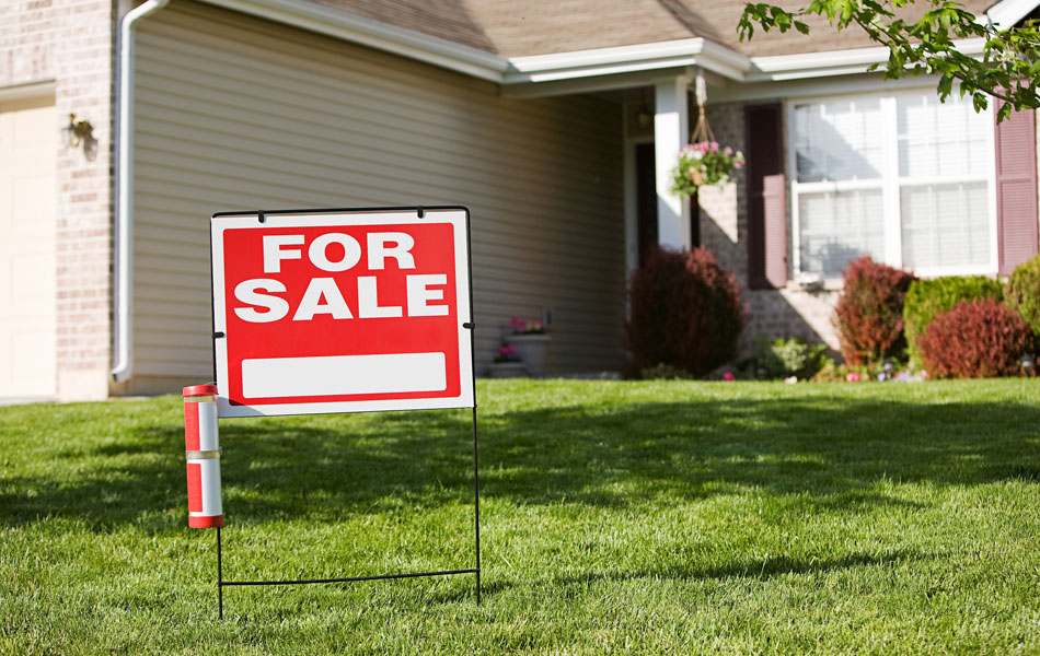 House with for sale sign on the lawn, that is getting a pre-listing inspection.